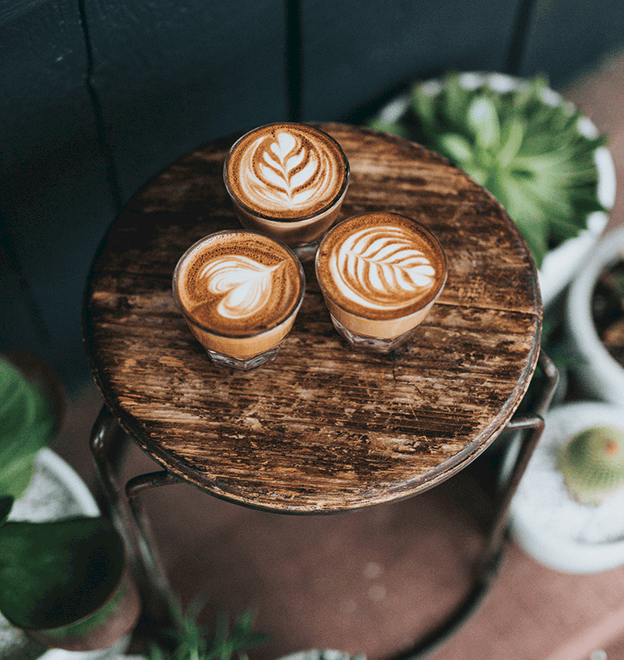 espresso shots on a small wooden table