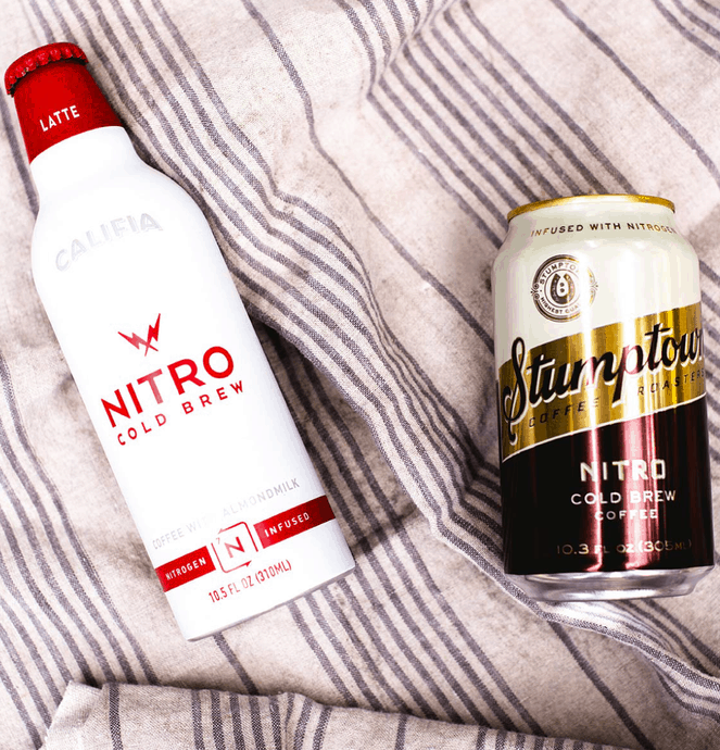 two types of nitro cold brews sitting on a blanket